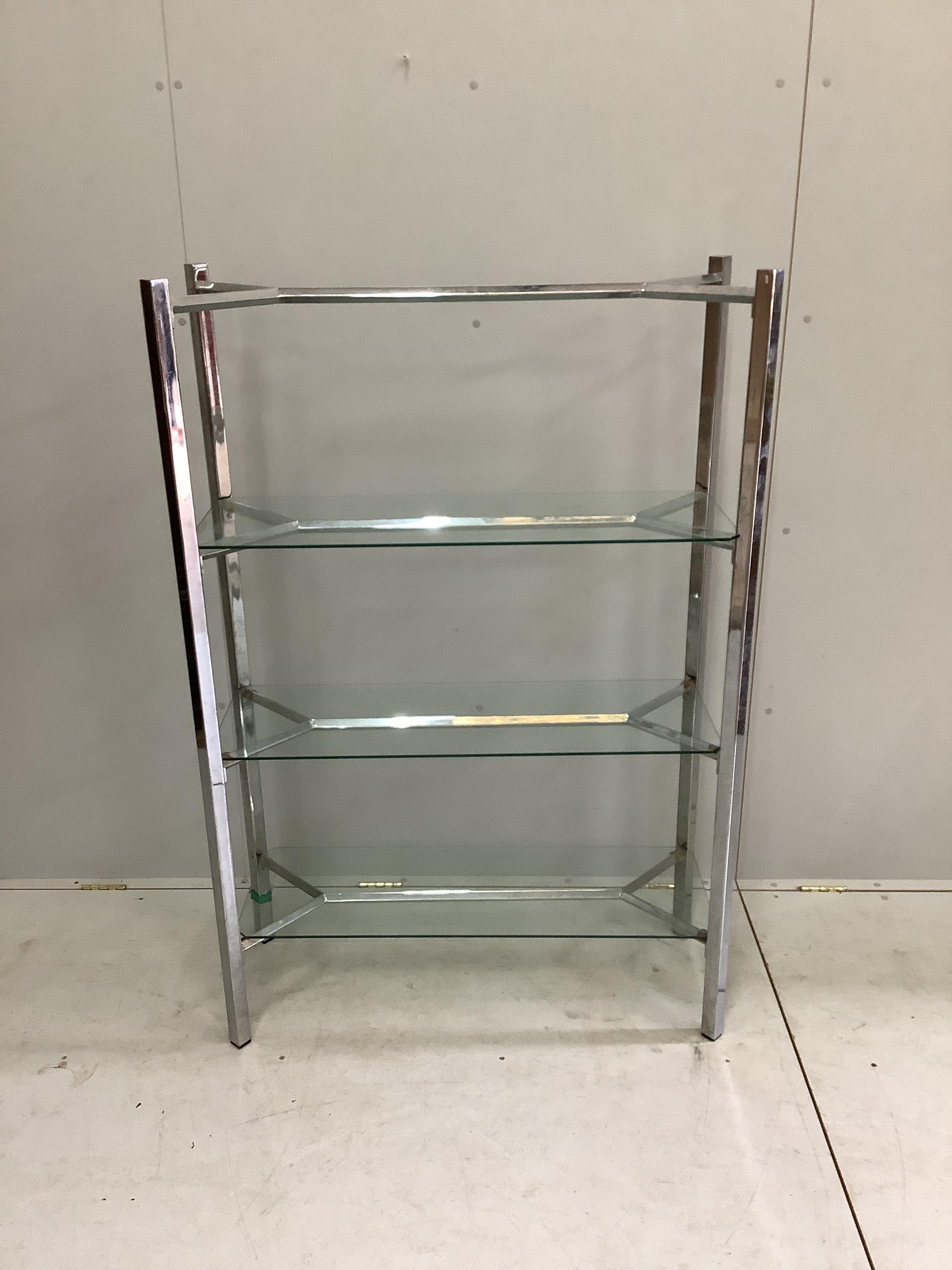 A contemporary chrome and glass three tier shelf unit, width 99cm, depth 38cm, height 147cm. Condition - fair